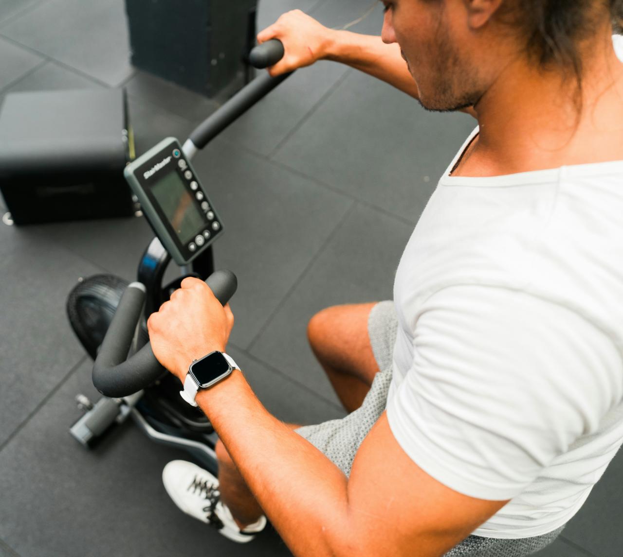 A man sitting on a stationary exercise bike